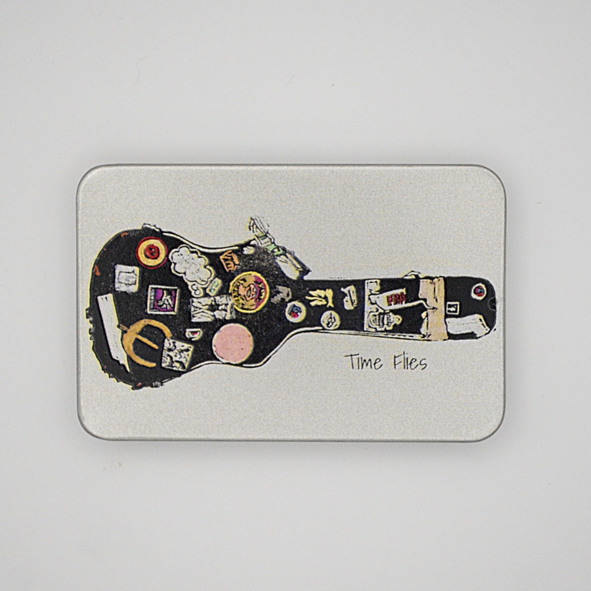 Silver rectangular tin with sliding lid featuring a guitar case image with the phrase 'Time Flies' written on it.
