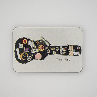 Silver rectangular tin with sliding lid featuring a guitar case image with the phrase 'Time Flies' written on it.