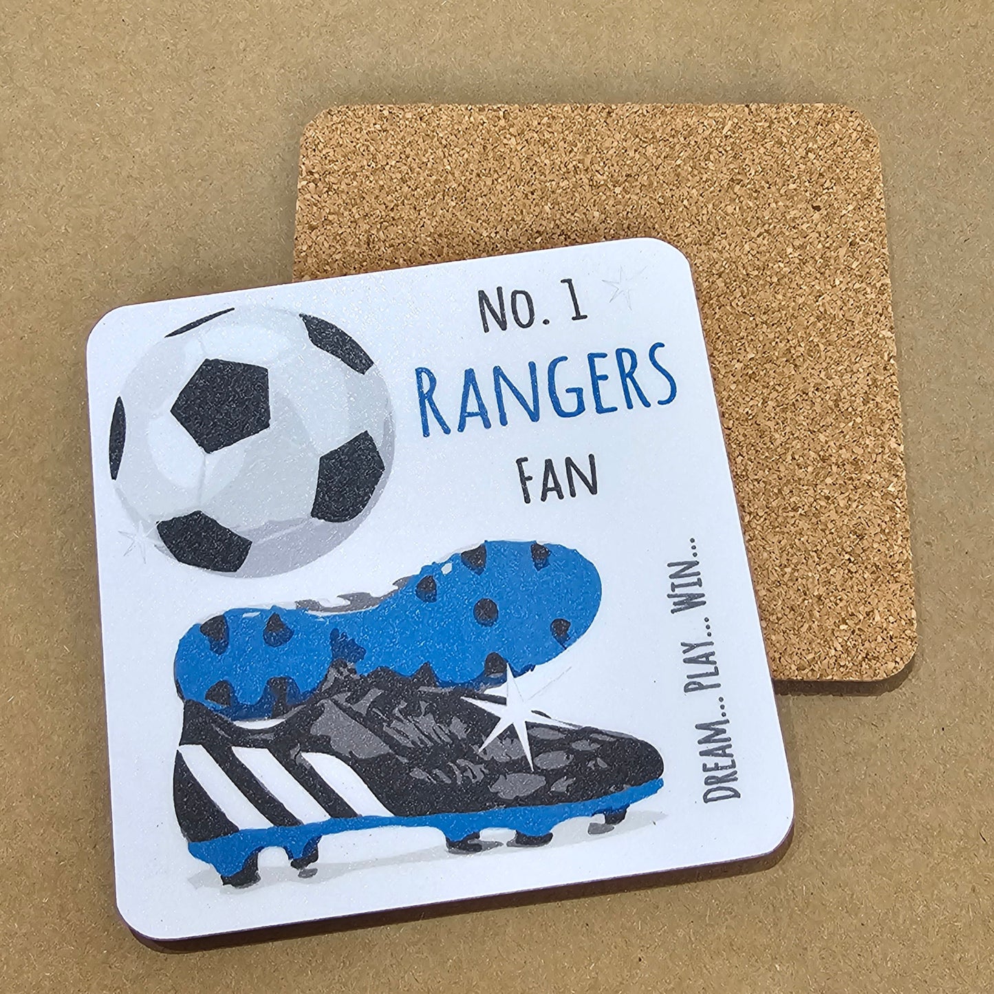 A square coaster with a cork base, featuring a football design with the text 'NO. 1 RANGERS FAN' and an image of a soccer ball and cleats.