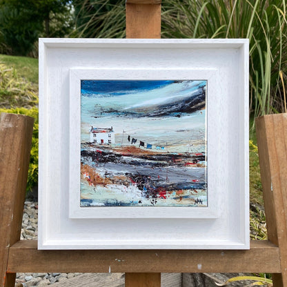 A ceramic tile print of a colourful painting titled 'Road to the Shee', showing a small house nestled in the Scottish Highlands, available mounted on natural slate or framed.