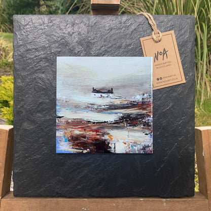 A ceramic tile print of a colourful painting titled 'Rolling Fog', showing a small house nestled in the Scottish Highlands, available mounted on natural slate or framed.