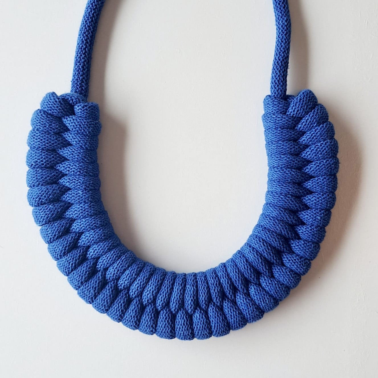 Ragged House large recycled cotton macrame cord knot necklace with figure 8 bow-shaped statement design