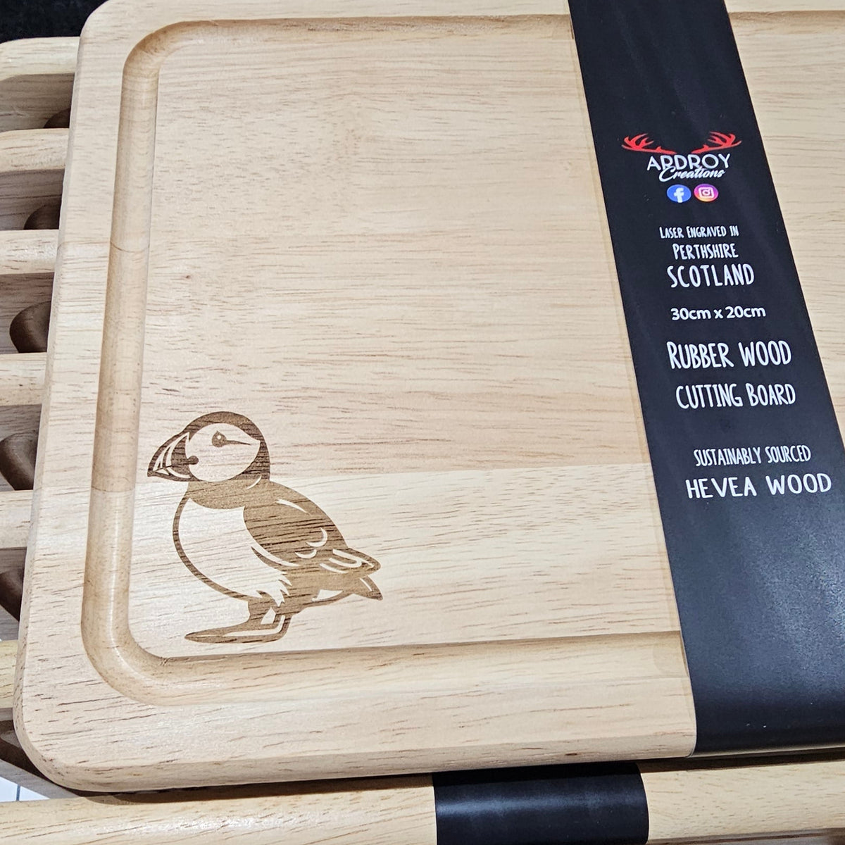 Ardroy Creations Scottish rubberwood boards measuring 30 x 20cm, featuring engraved Stag, Highland Coo, Thistle, Puffin, Red Squirrel and Landrover designs.