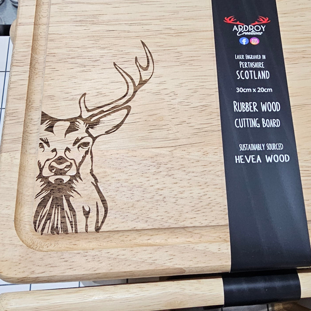 Ardroy Creations Scottish rubberwood boards measuring 30 x 20cm, featuring engraved Stag, Highland Coo, Thistle, Puffin, Red Squirrel and Landrover designs.