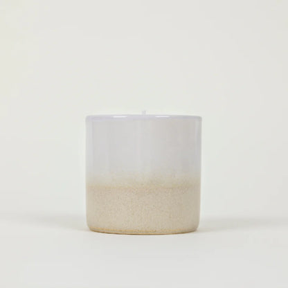 Cream and white St Eval Tranquility ceramic candle on a white background