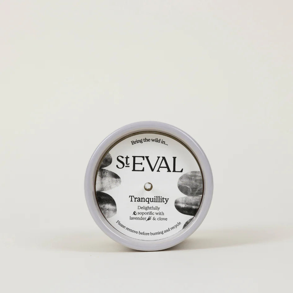 Cream and white St Eval Tranquility ceramic candle on a white background