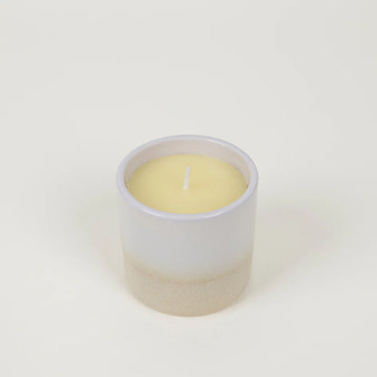 Cream and white St Eval Tranquility ceramic candle on a white background