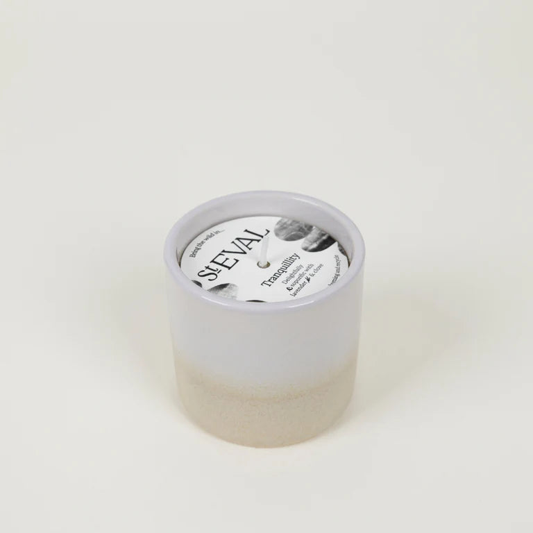 Cream and white St Eval Tranquility ceramic candle on a white background