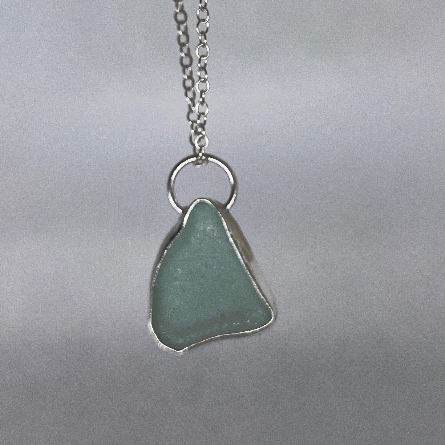 Sterling silver and seafoam green sea glass pendant necklace handmade in Dundee with triangle shape design