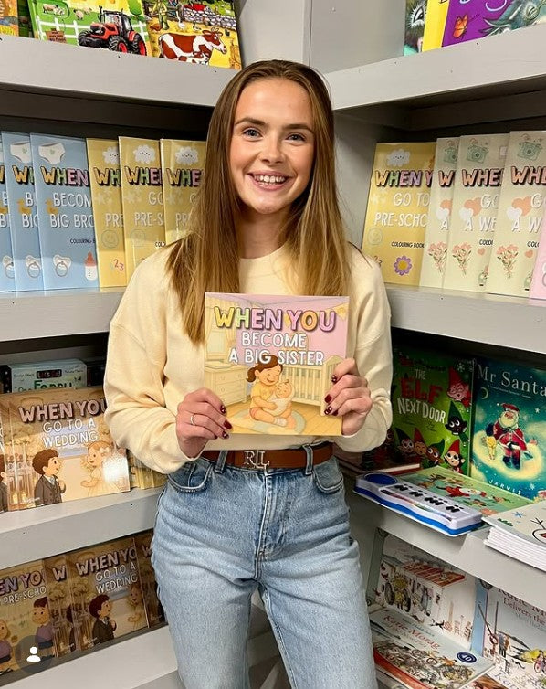 Image of Author Shelly Lawson holding her When You Become A Big Sister Book