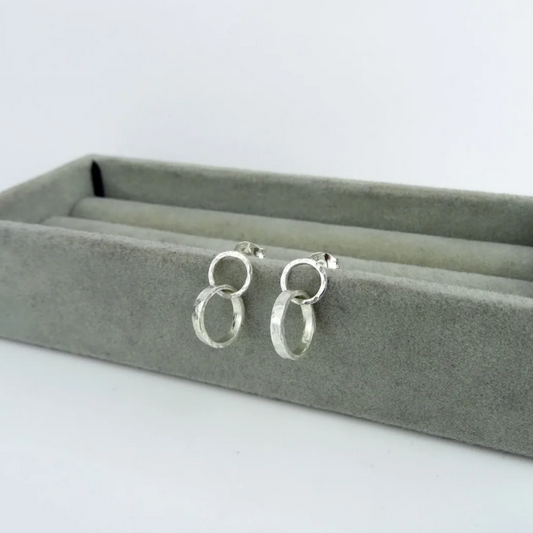 Scarlett Erskine Silver Little Sista Earrings featuring a petite double loop design, a smaller version of the original Sista Earrings.