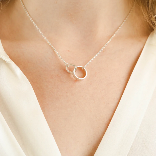 Scarlett Erskine Silver Sista Necklace featuring two interlocking handmade silver loops, one smooth and one textured, on a 16-18 inch chain.