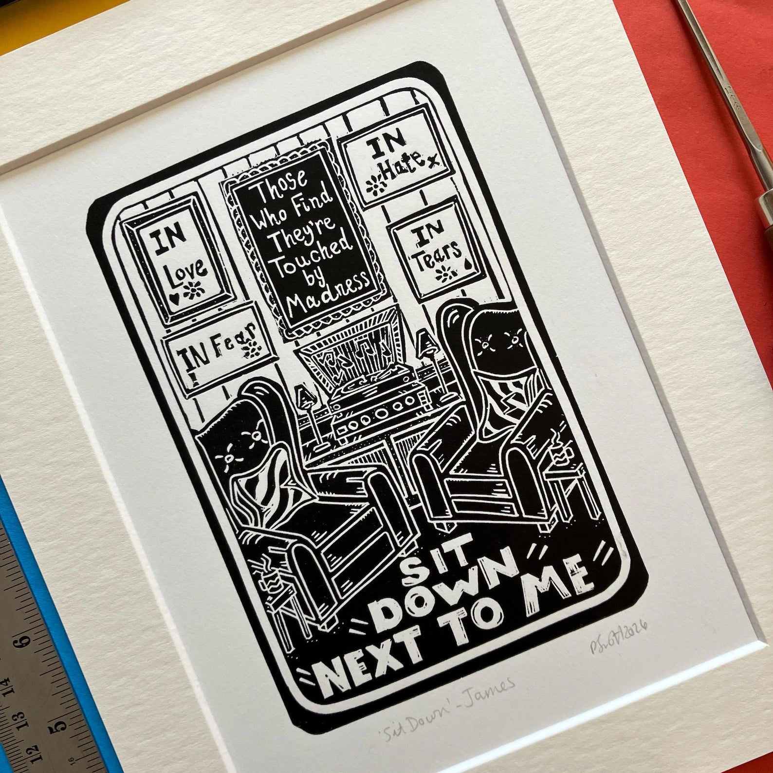 Sit Down by James Black and White Lino Print on a colourful background