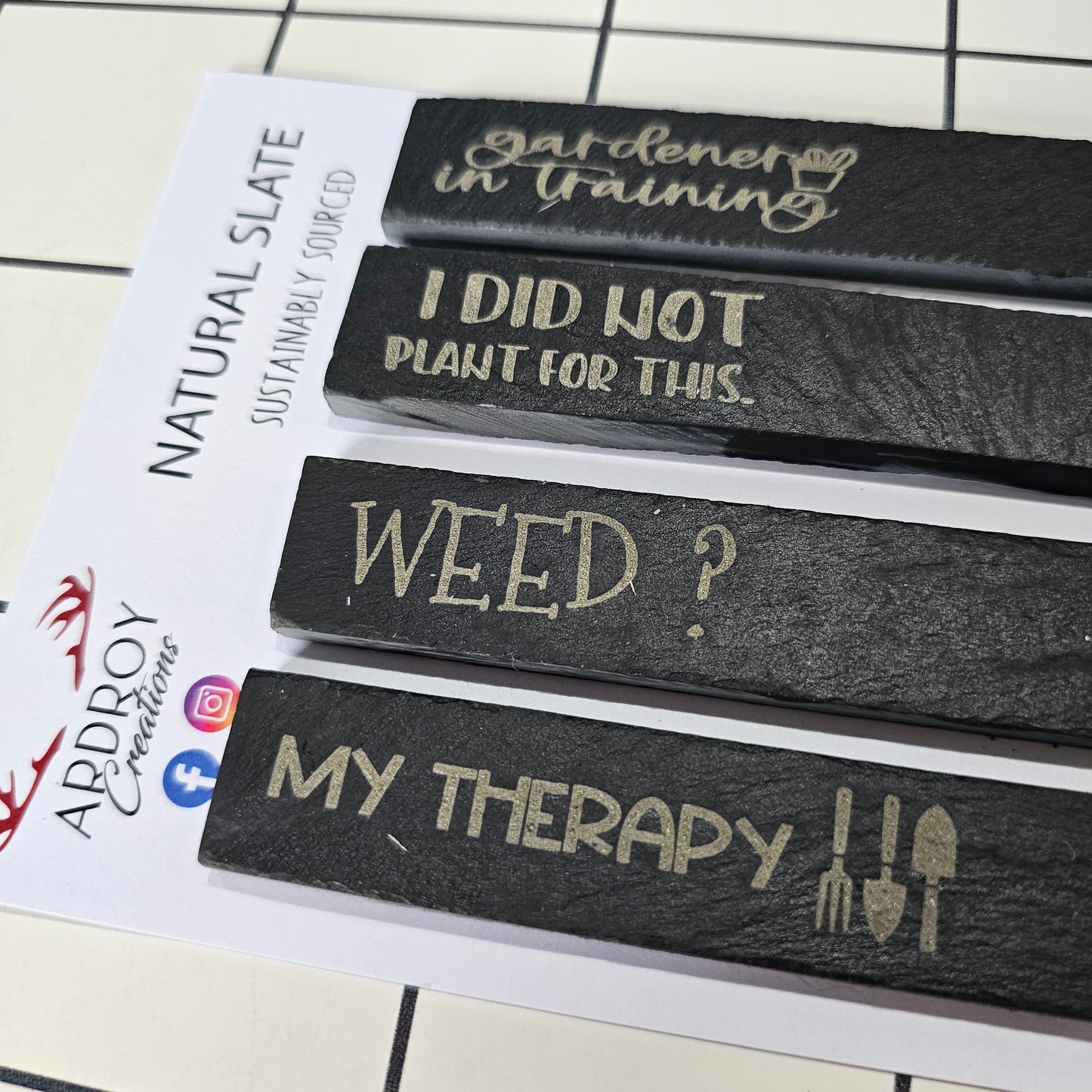 Set of four funny slate plant markers by Ardroy Creations featuring humorous gardening and plant slogans.