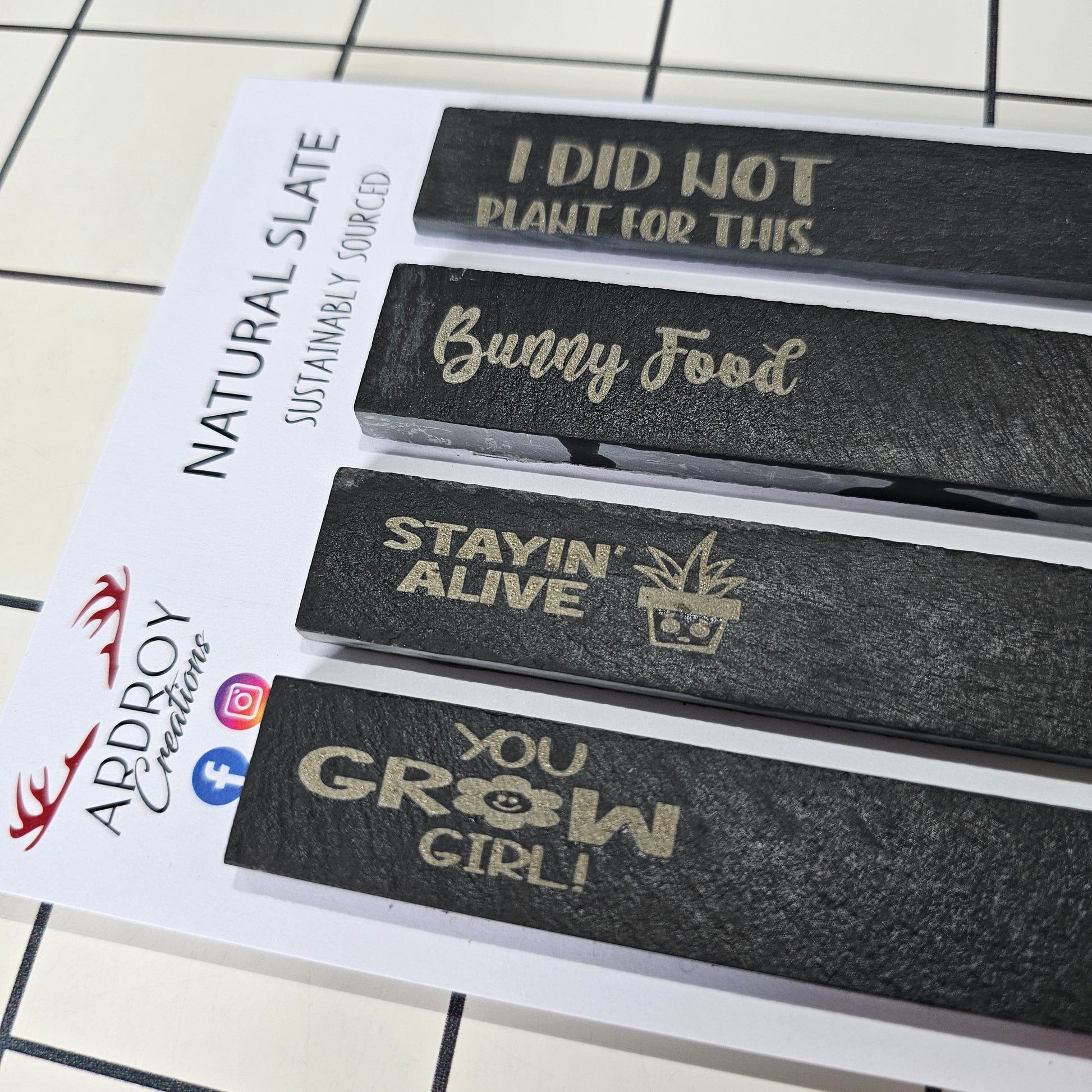 Set of four funny slate plant markers by Ardroy Creations featuring humorous gardening and plant slogans