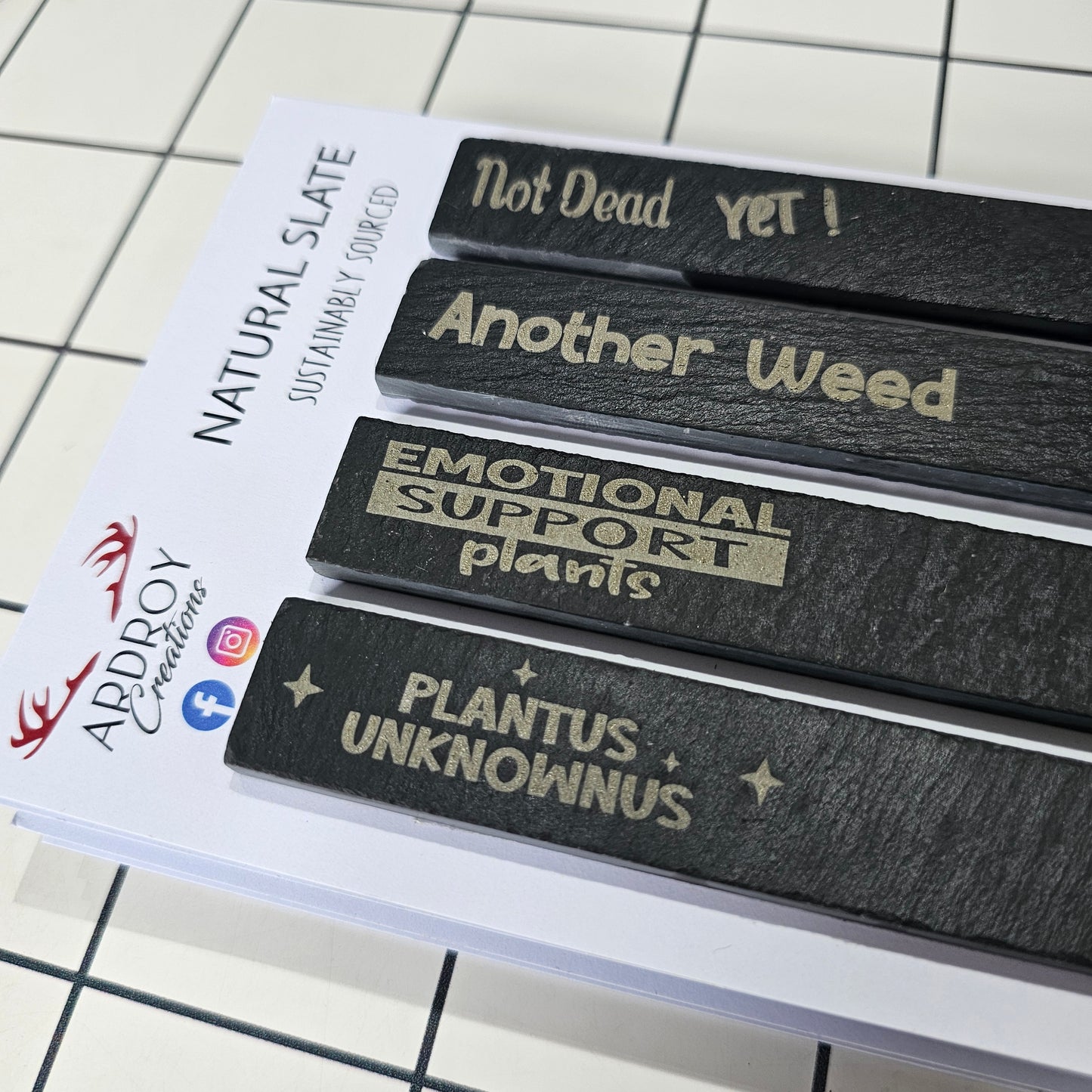 Set of four funny slate plant markers by Ardroy Creations featuring humorous gardening and plant slogans