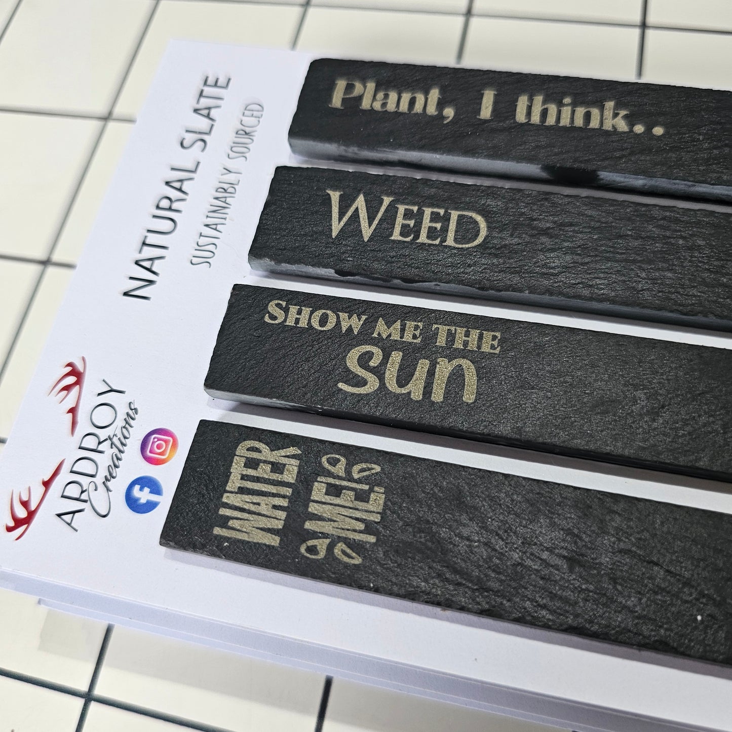 Set of four funny slate plant markers by Ardroy Creations featuring humorous gardening and plant slogans