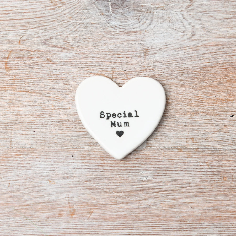 Heart-shaped white ceramic token with 'Special Mum' text