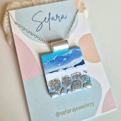 Sefara Jewellery coastal seascape pendant necklaces in circle and square designs, featuring unique 30mm pendants with gold leaf details on silver-plated chains.
