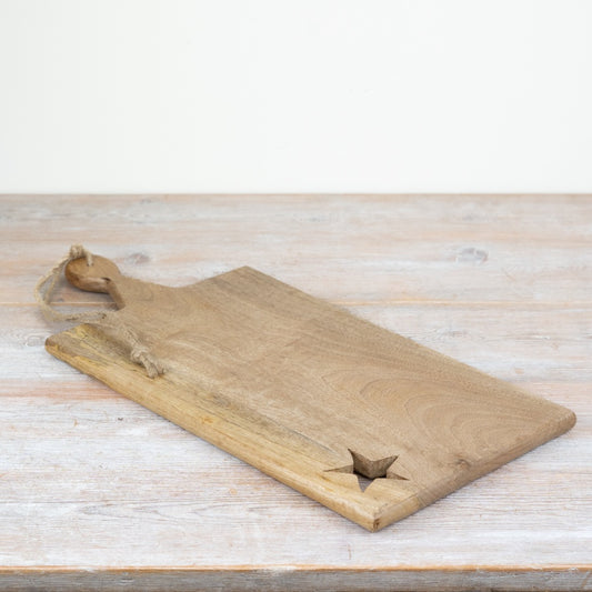 Wooden chopping board with decorative star design for food preparation and serving platters