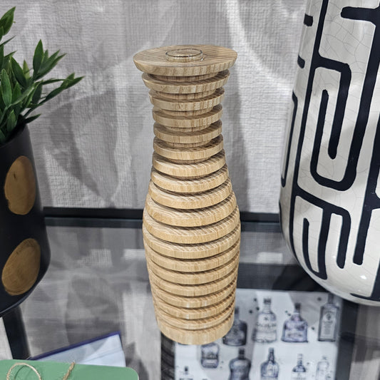 Handcrafted wooden vases made in Carnoustie using locally sourced wood, featuring natural grain, ribbed designs and styles with glass flower inserts.