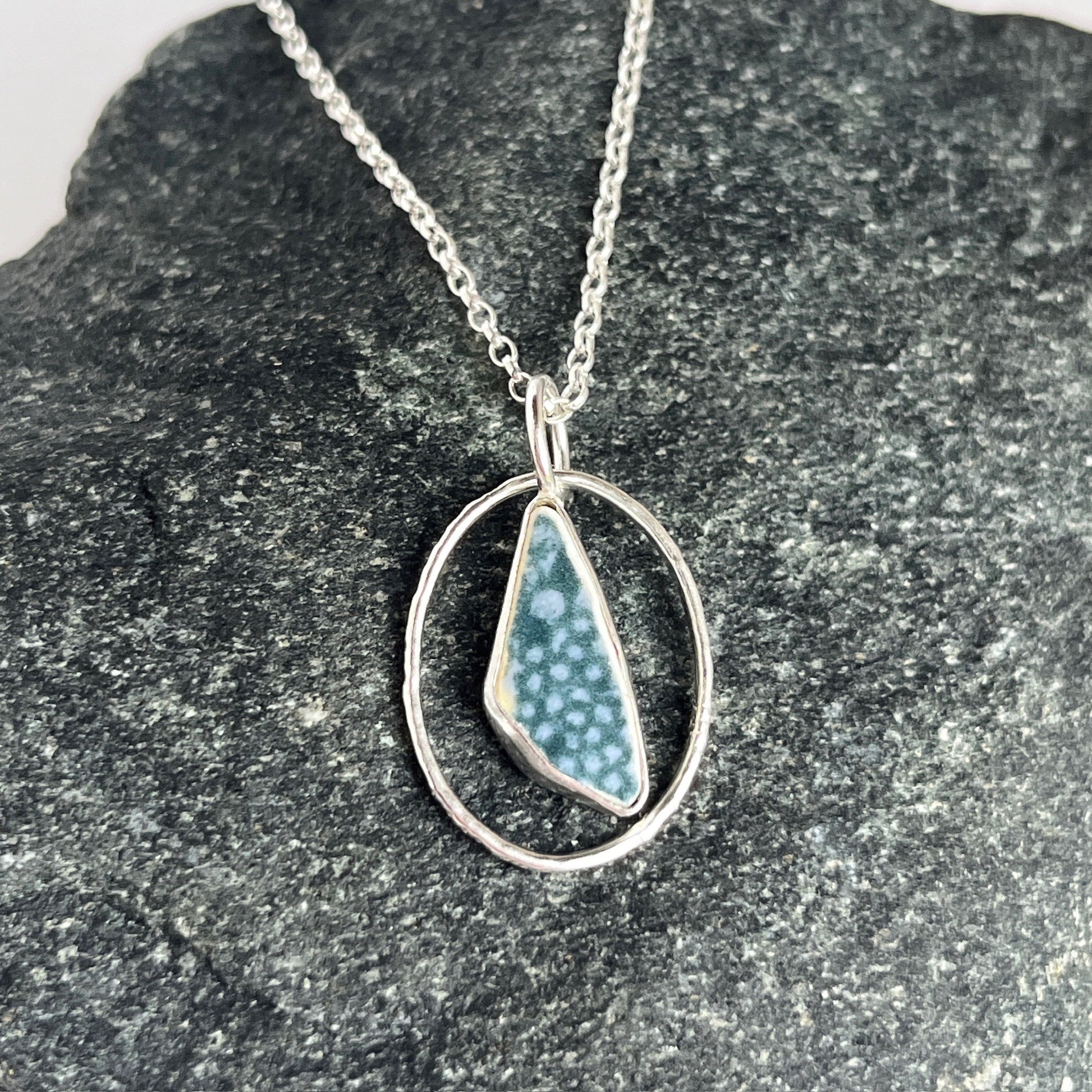 Sterling silver and teal sea pottery pendant necklace handmade in Dundee with unique shape within oval ring