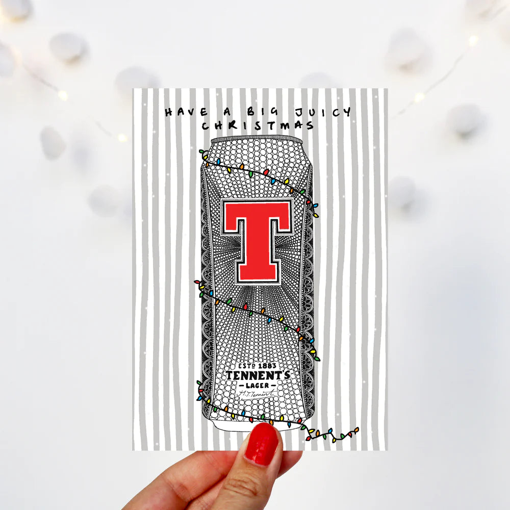 Scottish Tennents lager can Christmas card by Kilo Papa Studio, A6 recyclable design with hand-drawn illustration and Kraft envelope.