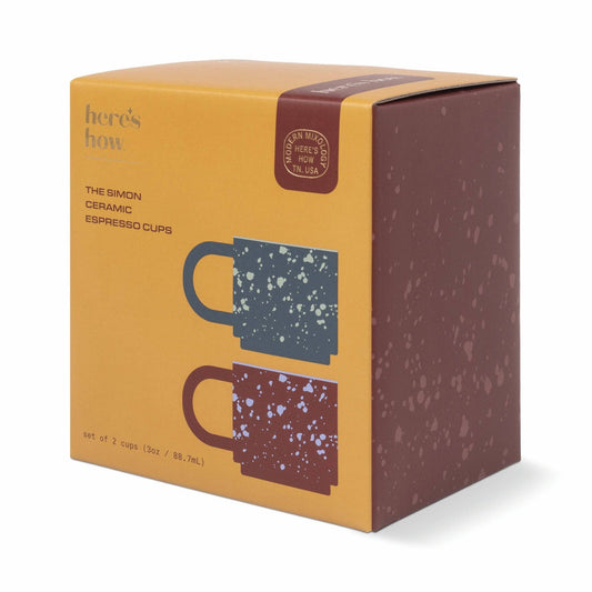 Here's How Simon set of two ceramic espresso cups in navy and burgundy with a playful spotted design