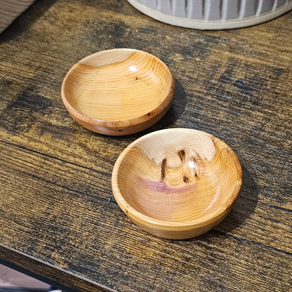 Two tiny wooden yew bowls handmade in Carnoustie by John Dowie