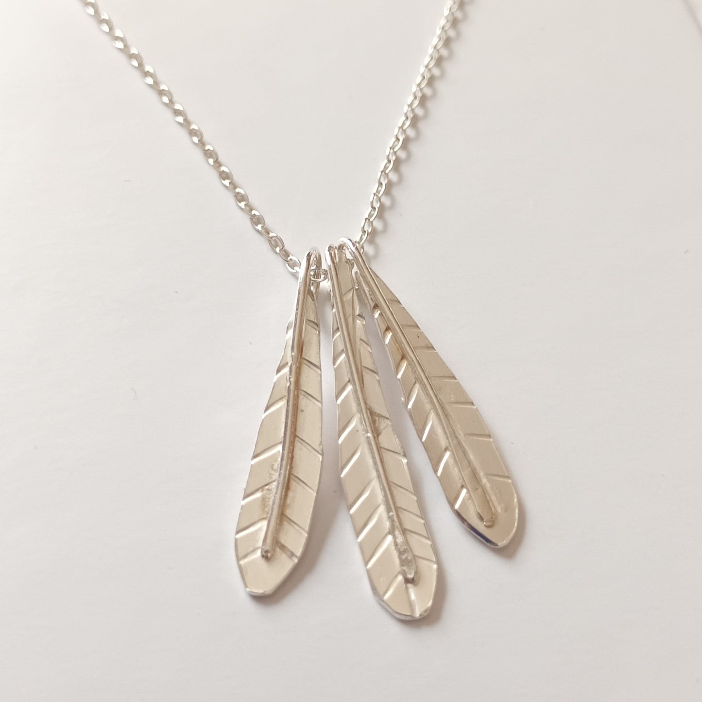 Sterling silver triple feather necklace by Diana King handmade in Perthshire