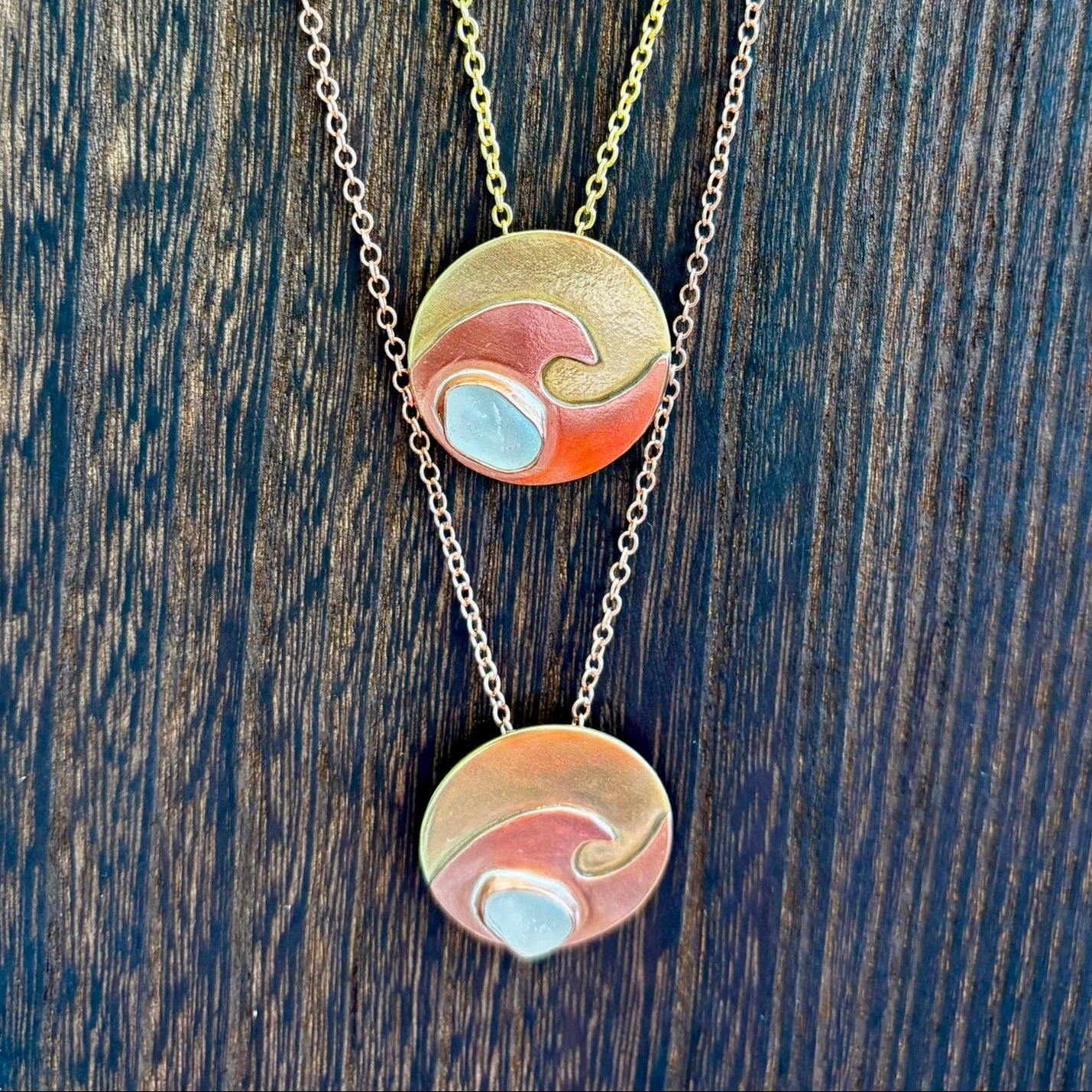 Copper wave and brass circle necklace by Rowan Berry Jewellery with genuine sea glass collected from Carnoustie beaches