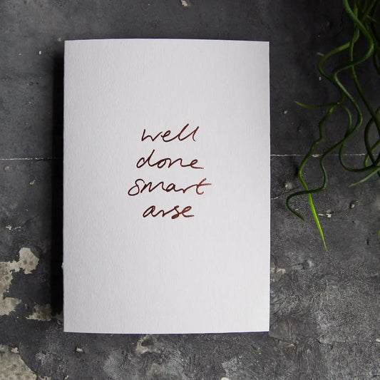 Well Done Smart Arse rose gold foil congratulations card on premium A6 textured card with matching envelope
