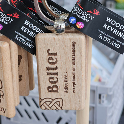 Solid beech wood keyrings by Ardroy Creations with Scottish designs, Scots words and wild swimming slogans