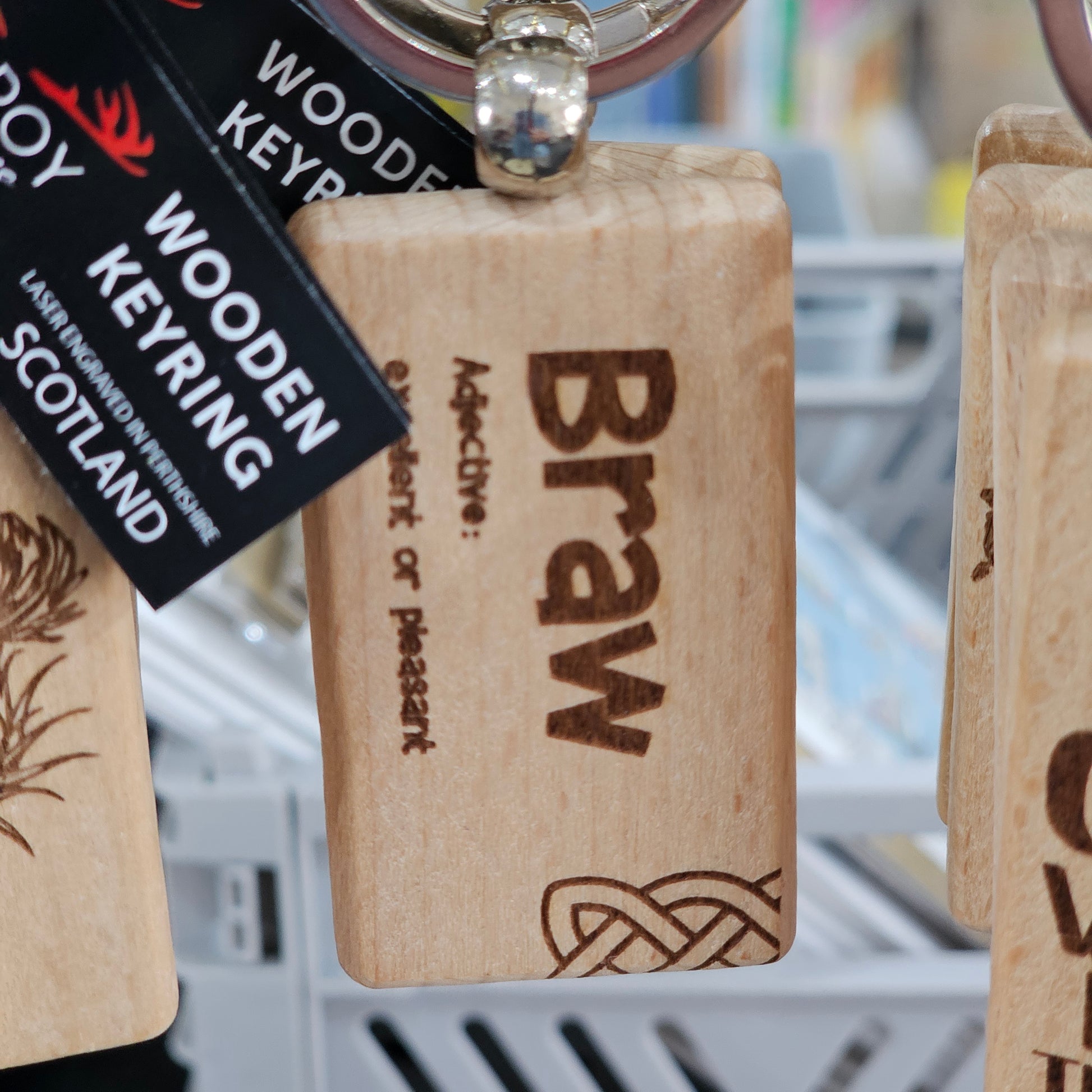 Solid beech wood keyrings by Ardroy Creations with Scottish designs, Scots words and wild swimming slogans