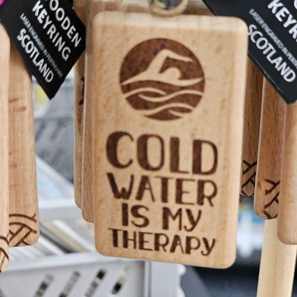 Solid beech wood keyrings by Ardroy Creations with Scottish designs, Scots words and wild swimming slogans