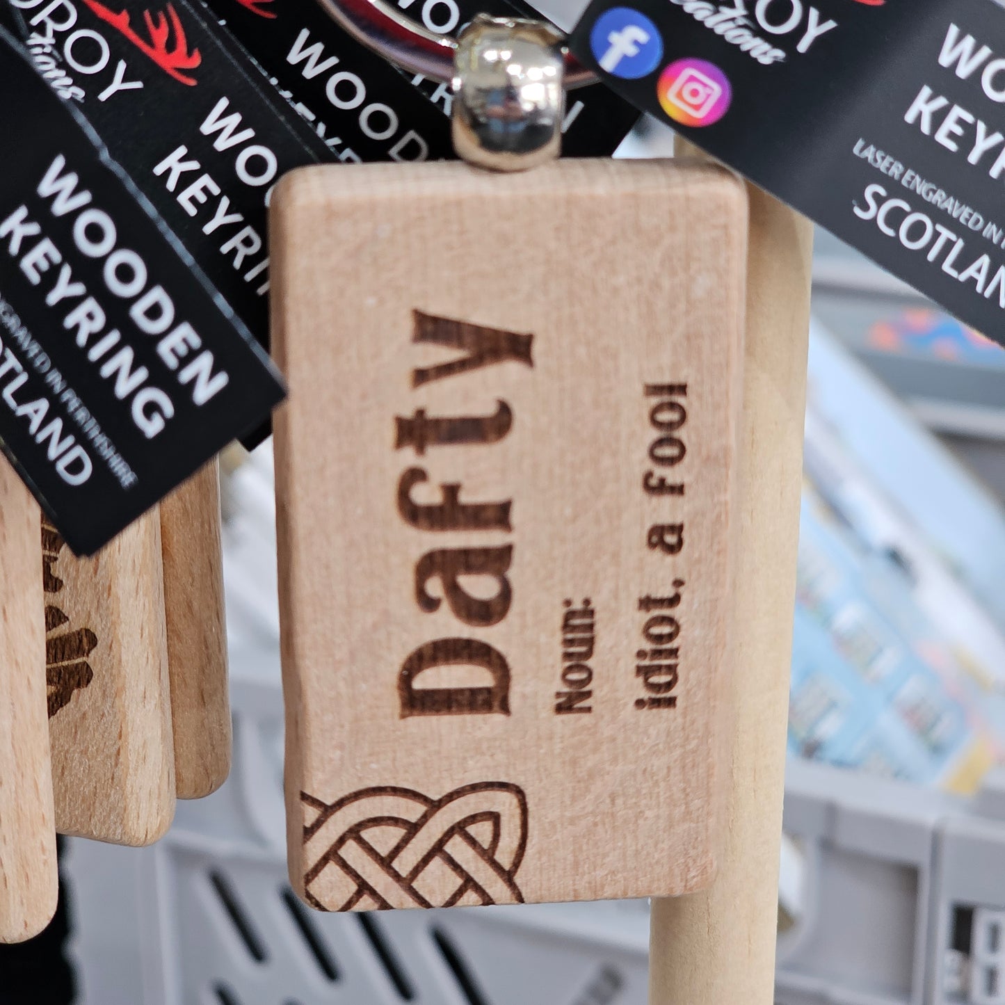 Solid beech wood keyrings by Ardroy Creations with Scottish designs, Scots words and wild swimming slogans