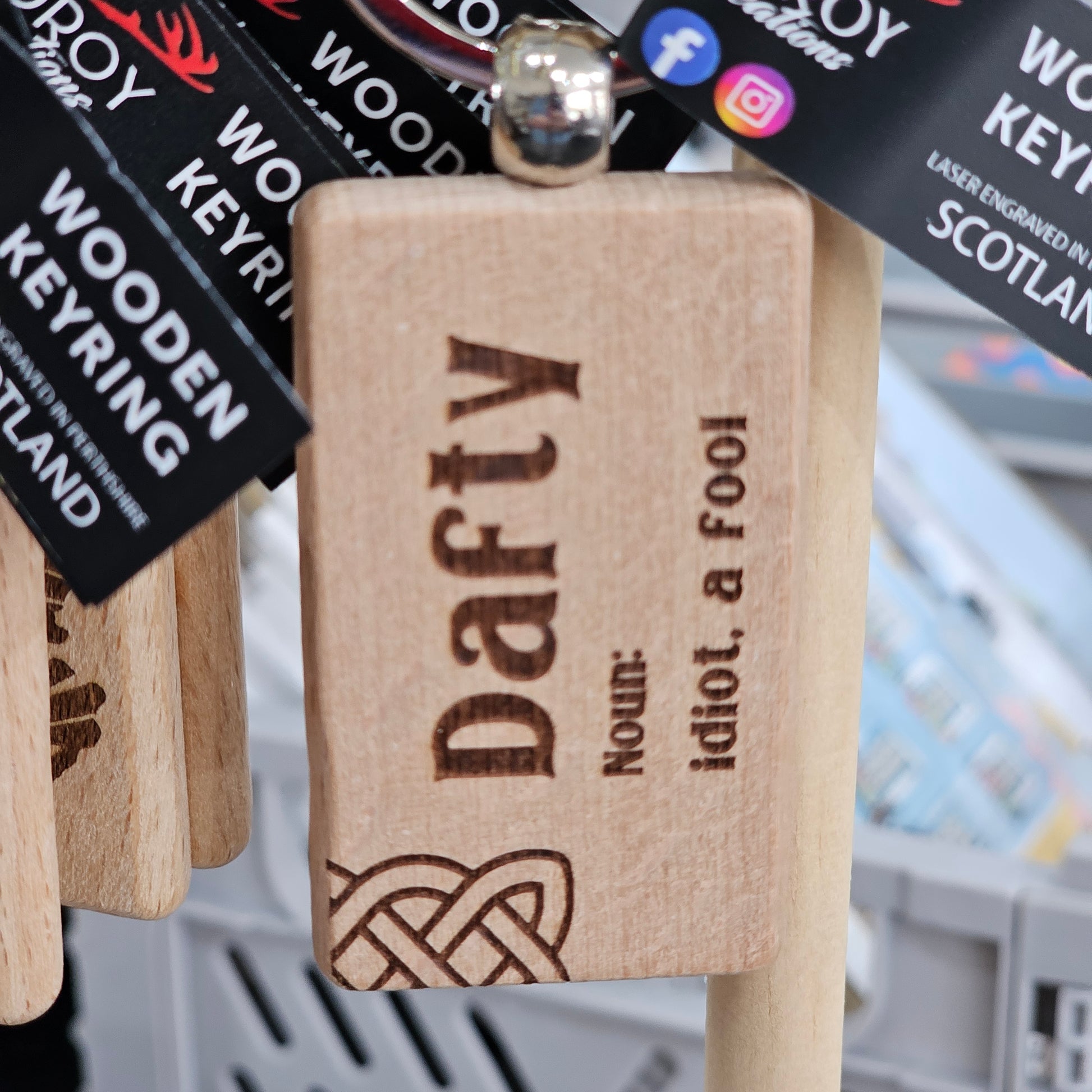 Solid beech wood keyrings by Ardroy Creations with Scottish designs, Scots words and wild swimming slogans