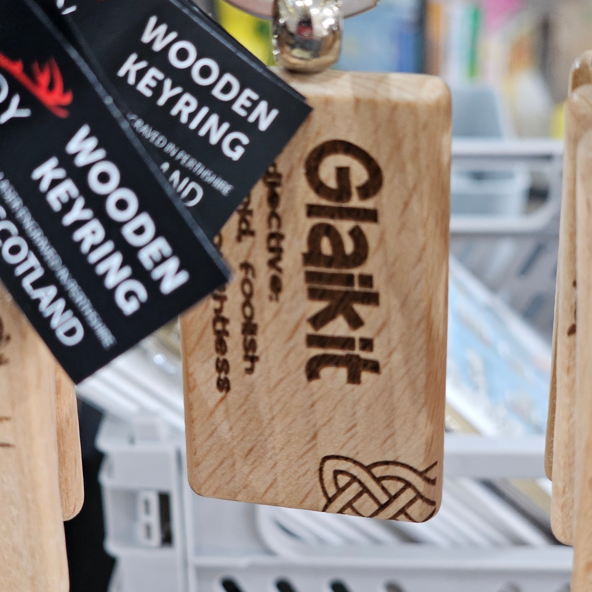 Solid beech wood keyrings by Ardroy Creations with Scottish designs, Scots words and wild swimming slogans