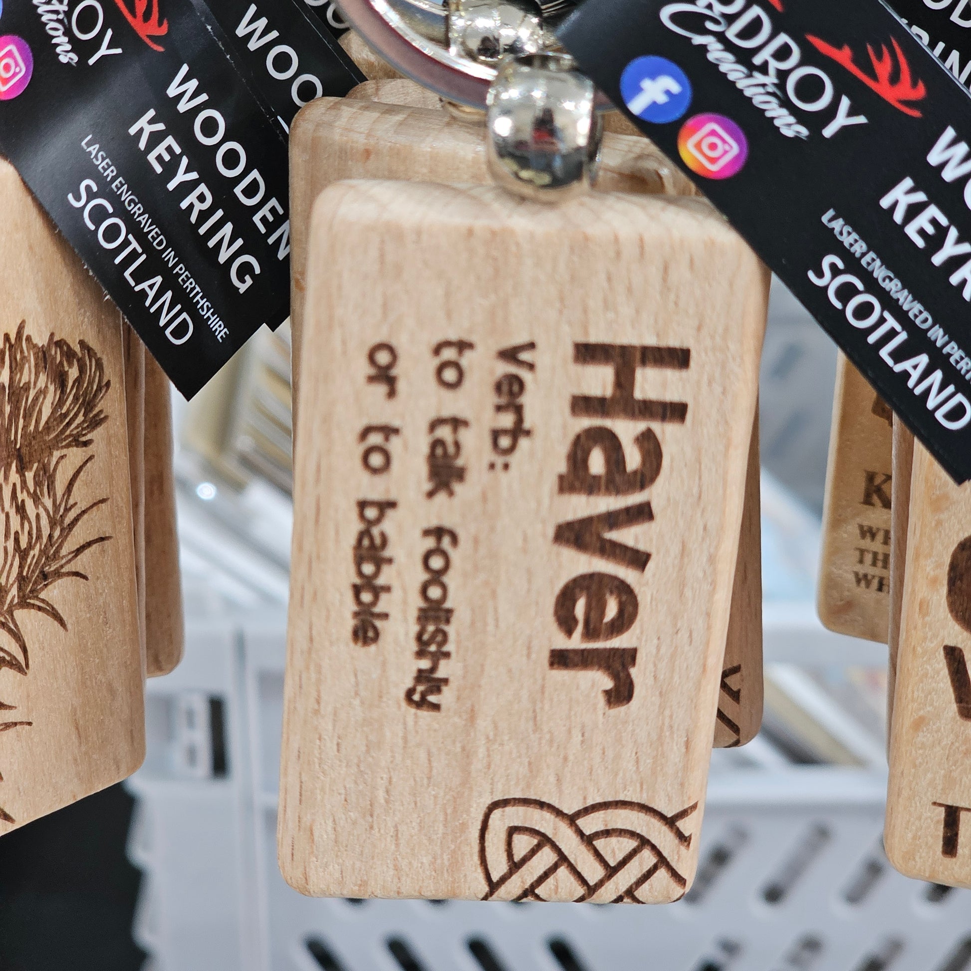 Solid beech wood keyrings by Ardroy Creations with Scottish designs, Scots words and wild swimming slogans