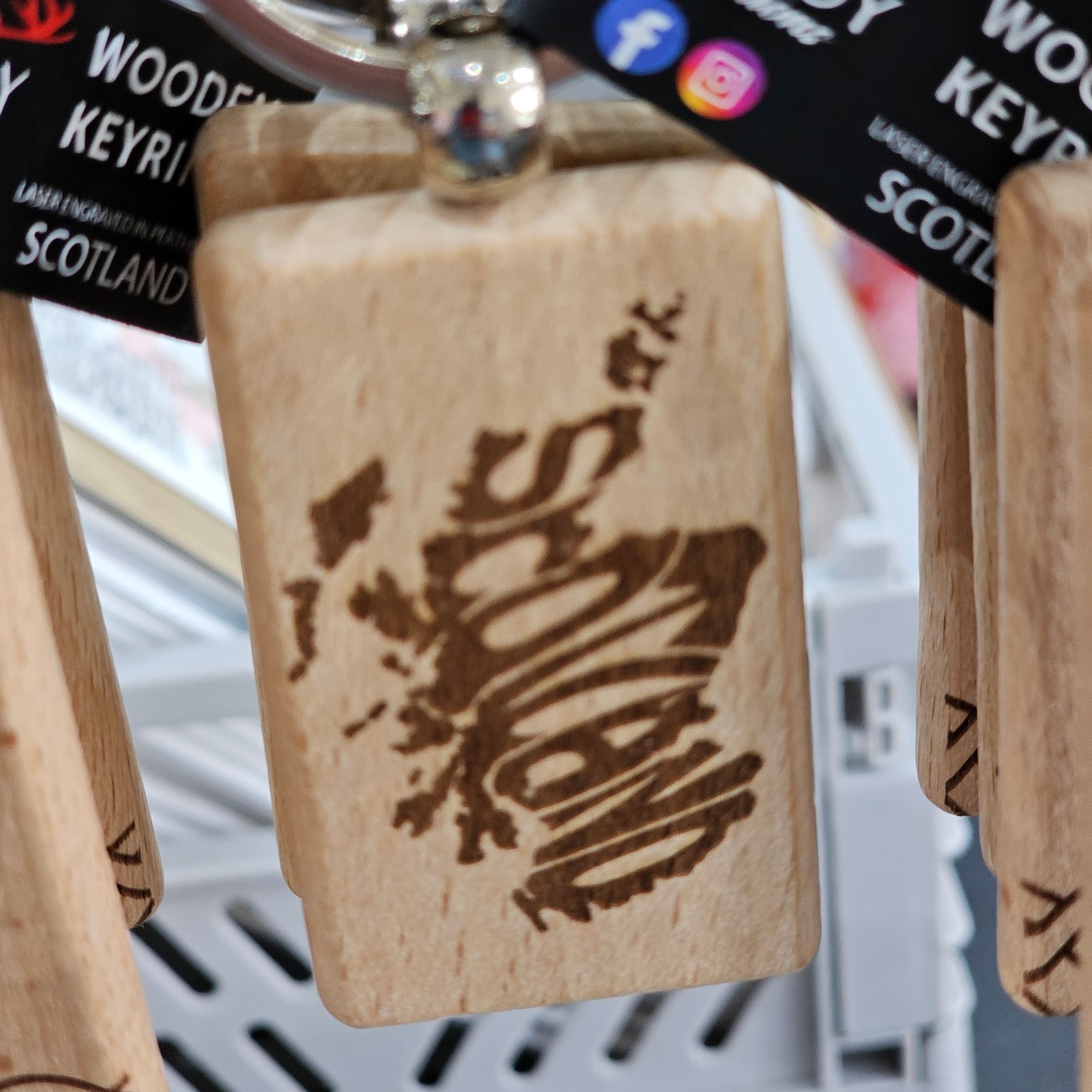 Solid beech wood keyrings by Ardroy Creations with Scottish designs, Scots words and wild swimming slogans