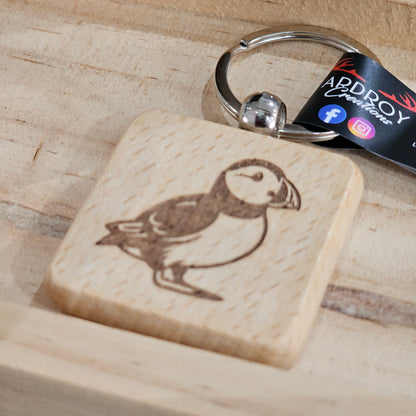 Solid beech wood keyrings by Ardroy Creations with Scottish designs, Scots words and wild swimming slogans