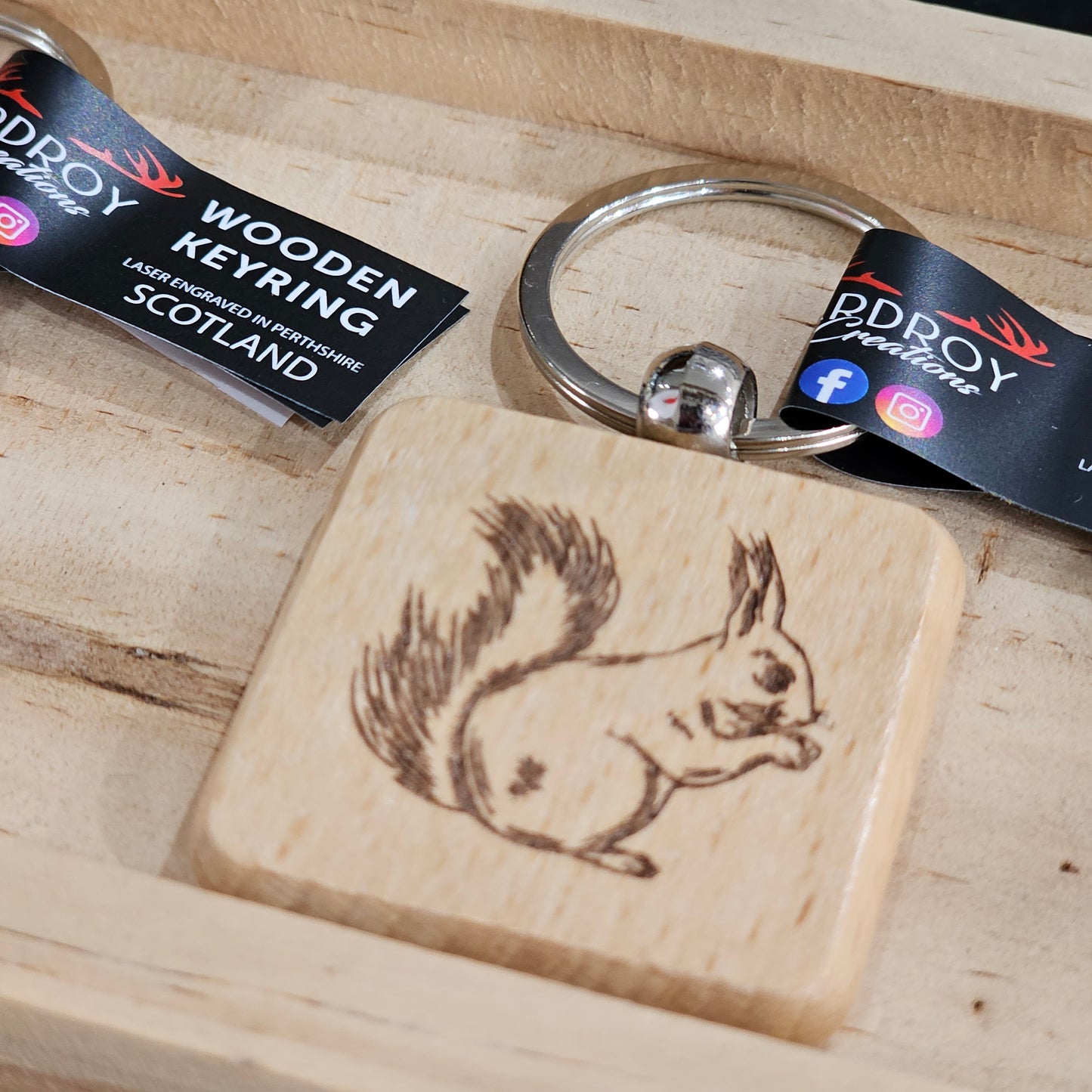 Solid beech wood keyrings by Ardroy Creations with Scottish designs, Scots words and wild swimming slogans