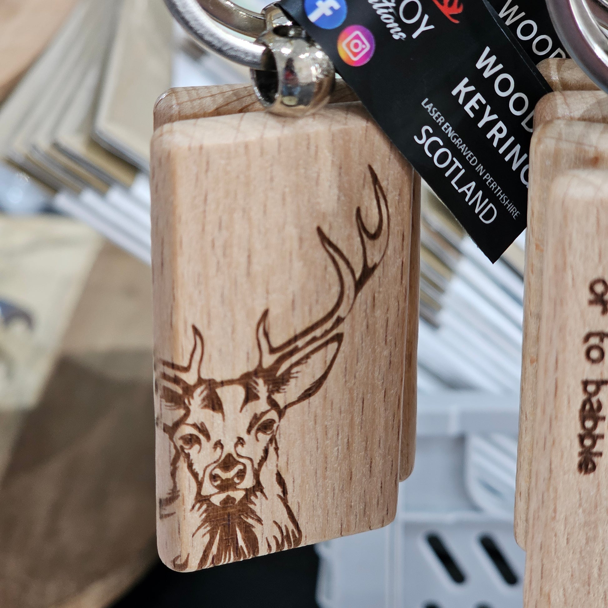 Solid beech wood keyrings by Ardroy Creations with Scottish designs, Scots words and wild swimming slogans