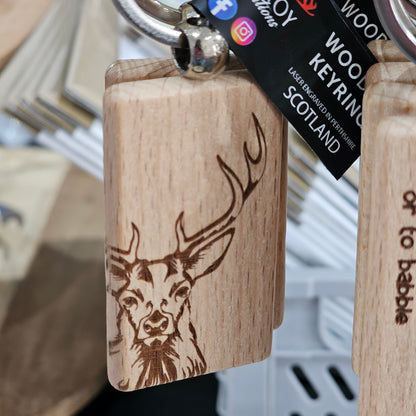 Solid beech wood keyrings by Ardroy Creations with Scottish designs, Scots words and wild swimming slogans