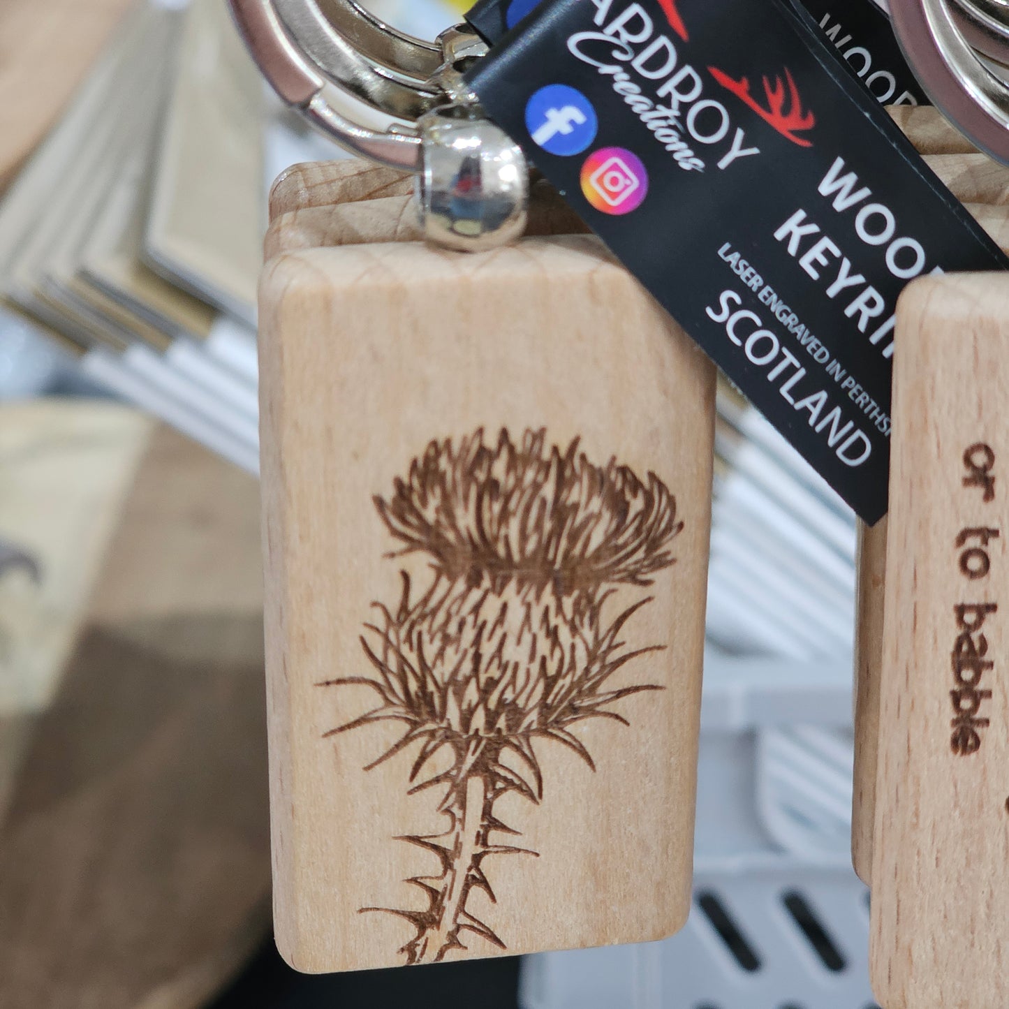Solid beech wood keyrings by Ardroy Creations with Scottish designs, Scots words and wild swimming slogans