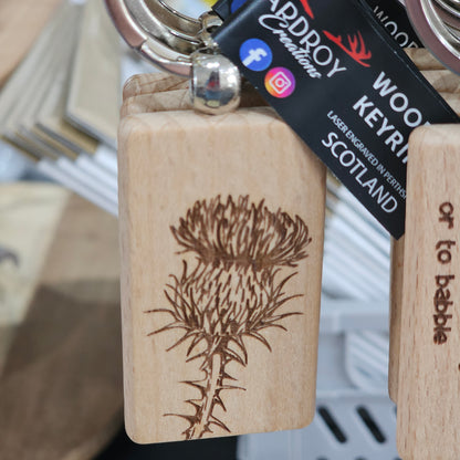 Solid beech wood keyrings by Ardroy Creations with Scottish designs, Scots words and wild swimming slogans