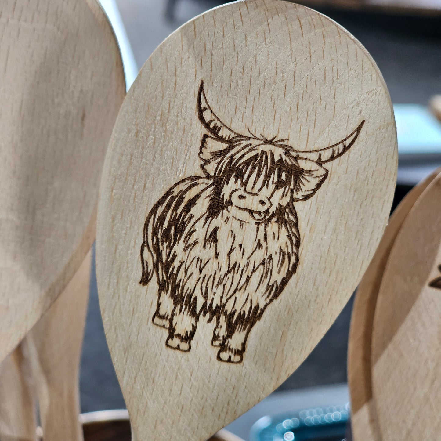 Scottish solid beech wooden spoon by Ardroy Creations with Highland Coo design