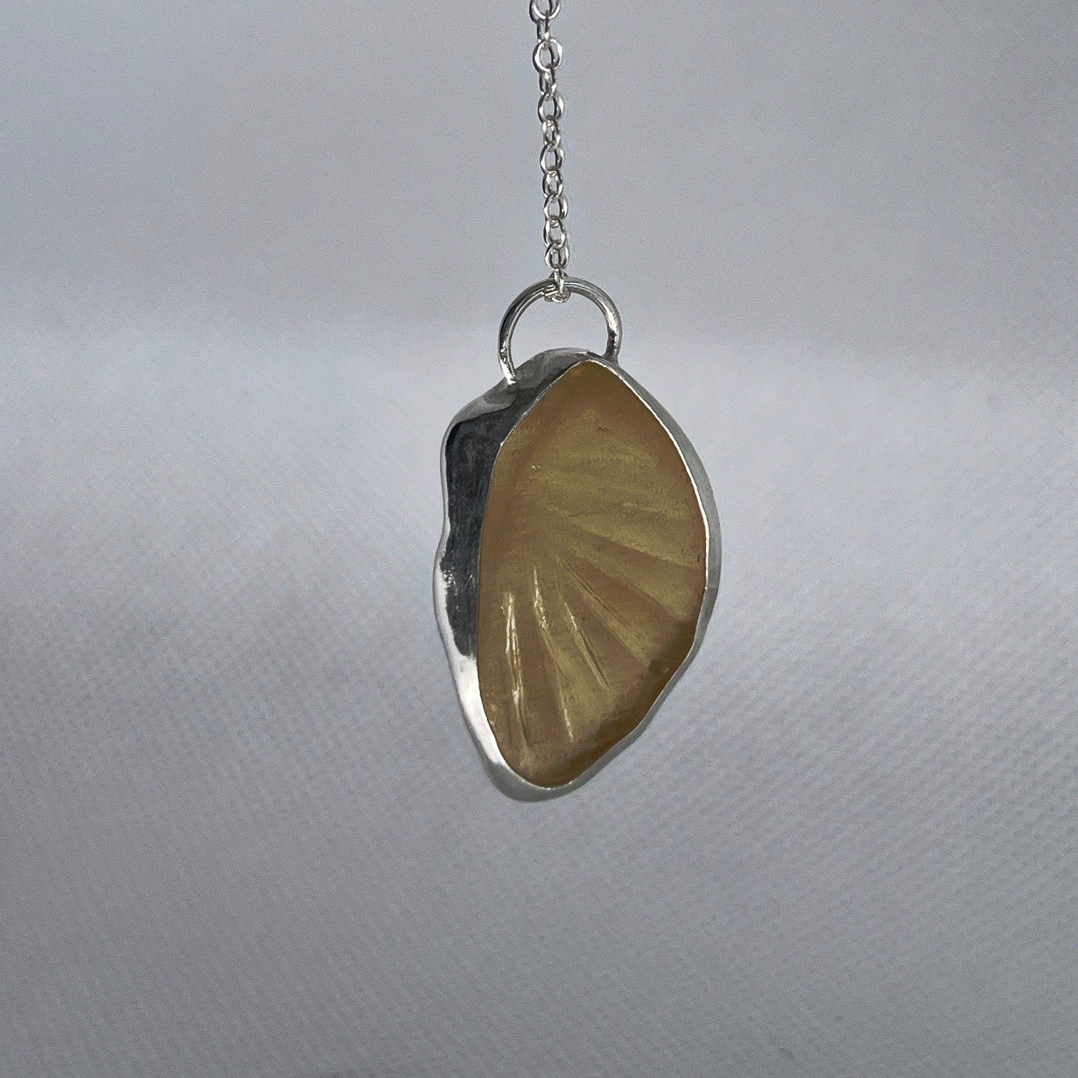 Sterling silver and yellow sea glass pendant necklace handmade in Dundee with oval shape design