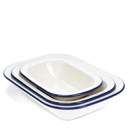 Set of three white enamel pie dishes with blue rim in assorted sizes