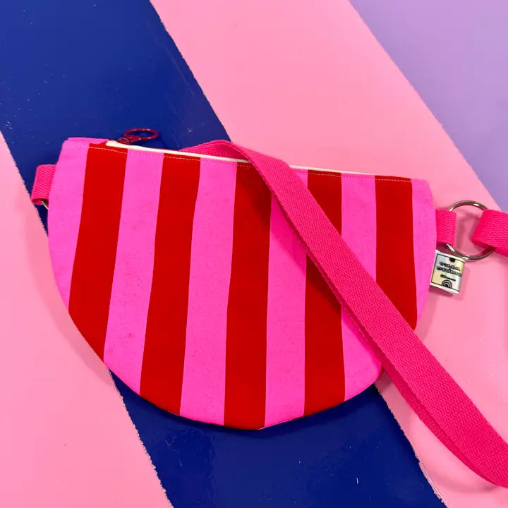 Handprinted crossbody bag handmade in Dundee from water-resistant wax cotton with padded lining, inner pocket and adjustable strap.